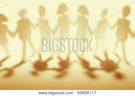 Anonymous paper chain people holding hands