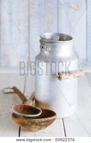 retro kitchen utensils tools on old wooden table in rustic style