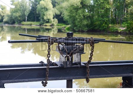 Lock with a chain on the lock screw