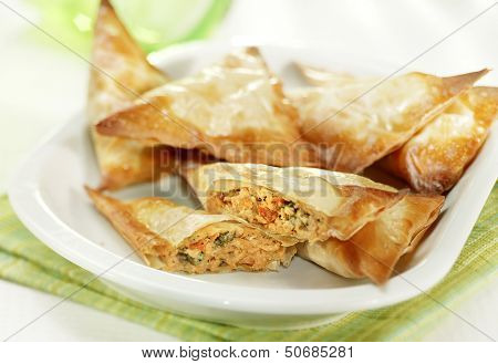 Patties Filled With Salmon Served On A White Plate