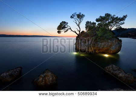 Sunset at beach with Kamen Brela (Brela Stone), Brela, Adriatic Sea, Croatia