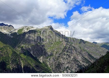 Mountain peaks in Dombai. Summer in cloudy weather