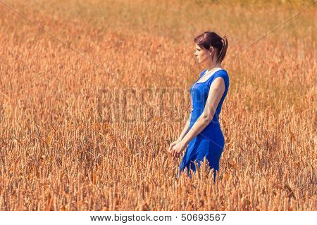 Beautiful Young Woman With Pretty Dress In Nature