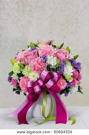 Flower Bouquet In White Ceramic Pot