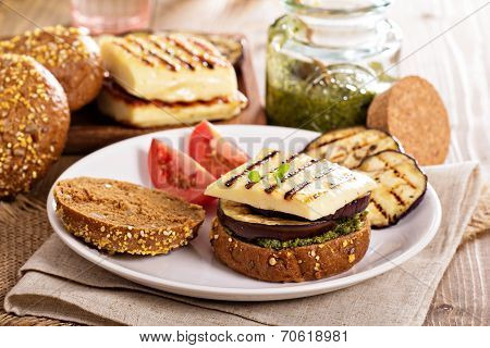 Vegetarian burger with cheese, eggplant and pesto