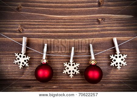 Christmas Decoration On A Line On Wooden Background