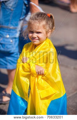 ODESSA, UKRAINE - August 23: Flash mob in city of Odessa on Potemkin Stairs on August 23, 2014, in day of a national flag of Ukraine. Happy participants kids of summer Flash mob with a flag
