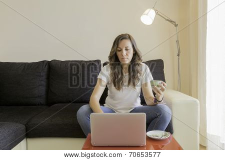 Young Woman Using A Laptop At Home