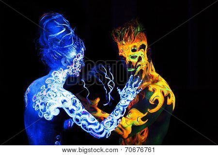 Body art glowing in ultraviolet light,  four elements, Air against Fire