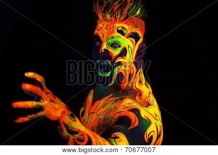 Body art glowing in ultraviolet light -  Fire 