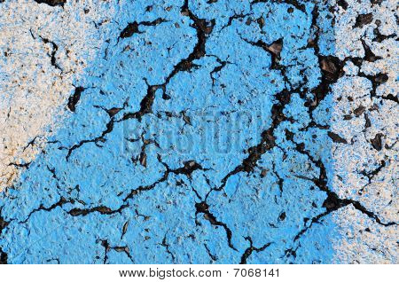 Blue paint on asphalt