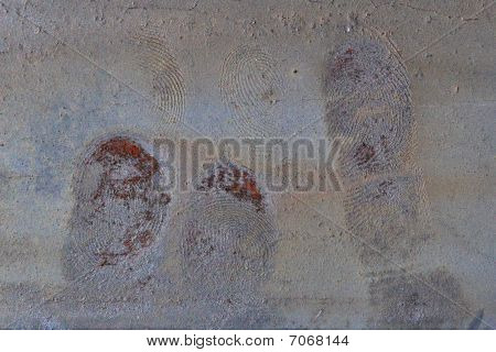 rusty fingerprints on metalic paint