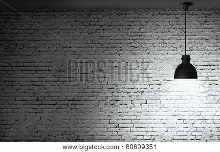 White grunge brick wall and black plafond are lights wall and floor from stone 