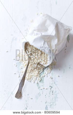 Risotto rice in a white paper bag 