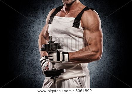 Athletic Muscular Young Man With Dumbbells On Bright Background