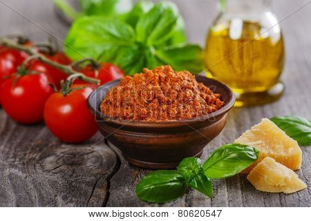 pesto sauce red rosso on a wooden surface