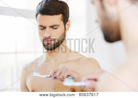 Feeling Displeased With His New Toothbrush.