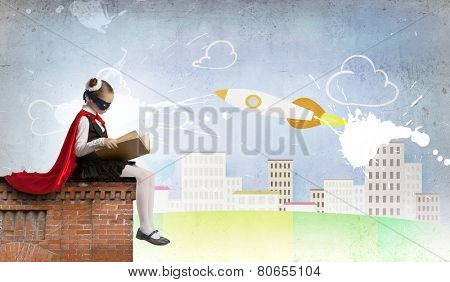 Girl of school age in super hero costume