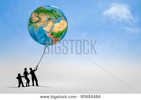 Silhouettes of people pulling Earth plane with rope. Elements of this image are furnished by NASA