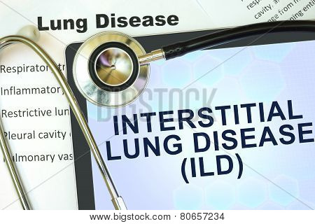 Tablet with word Interstitial lung disease (ILD) and stethoscope.