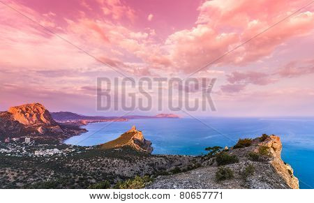 Beautiful sunset above the sea and mountain