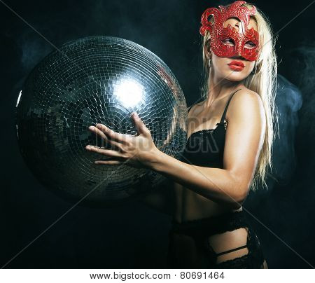 lady in mask with disco ball