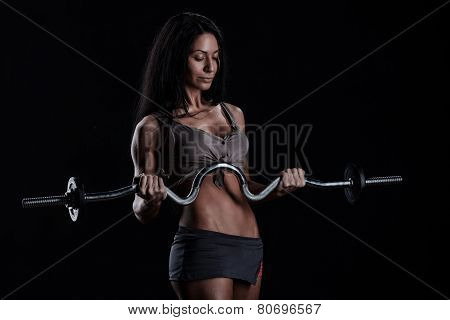 Brutal Athletic Woman Pumping Up Muscles With Dumbbells