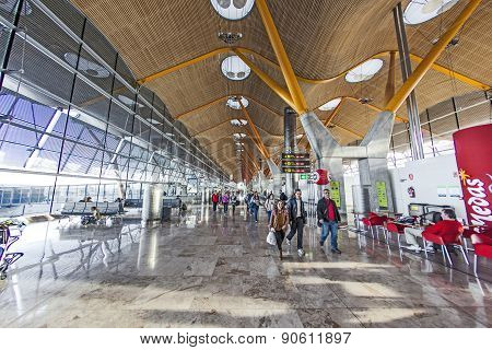 Passengers Walk By At The New Terminal T4 At Barajas Airport