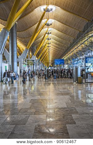 Passengers Walk By At The New Terminal T4 At Barajas Airport
