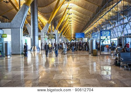Passengers Walk By At The New Terminal T4 At Barajas Airport