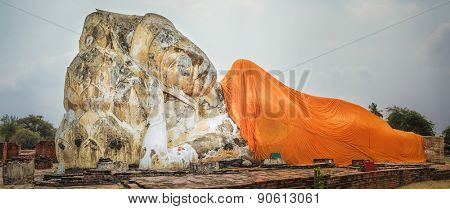 Giant Reclining Buddha in Wat Lokayasutharam. Ayutthaya historical park. Panorama