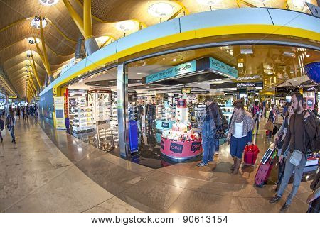 Passengers Walk By At The New Terminal T4 At Barajas Airport On April 1,2012 In Madrid. This Additio