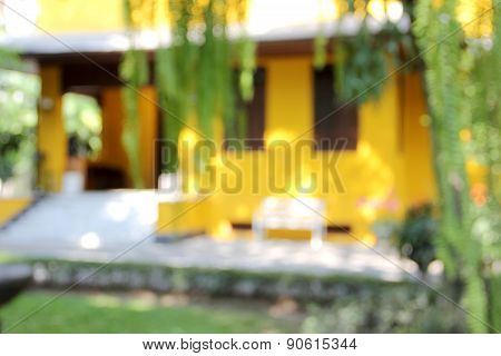 Blur Yellow House With White Chair