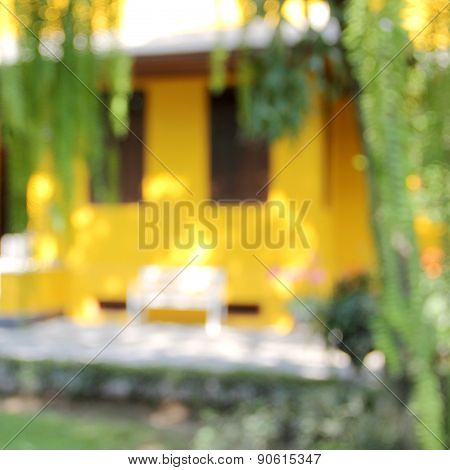 Blur Yellow House With White Chair