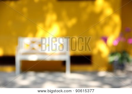 Blur Yellow House With White Chair