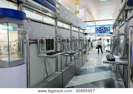 DUBAI, UAE - MARCH 10, 2015: DXB airport interior. Dubai International Airport is an international airport serving Dubai. It is a major airline hub in the Middle East, and is the main airport of Dubai
