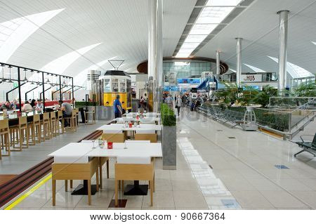 DUBAI, UAE - MARCH 10, 2015: DXB airport interior. Dubai International Airport is the primary airport serving Dubai, and is the world's busiest airport by international passenger traffic.