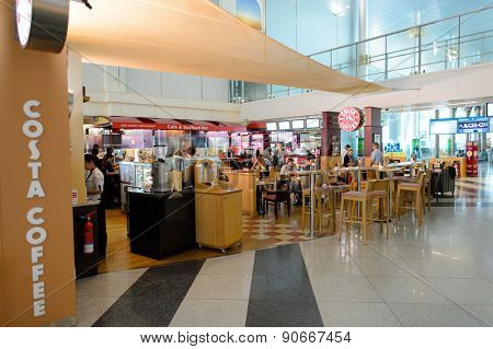 DUBAI, UAE - MARCH 10, 2015: DXB airport interior. Dubai International Airport is the primary airport serving Dubai, and is the world's busiest airport by international passenger traffic.