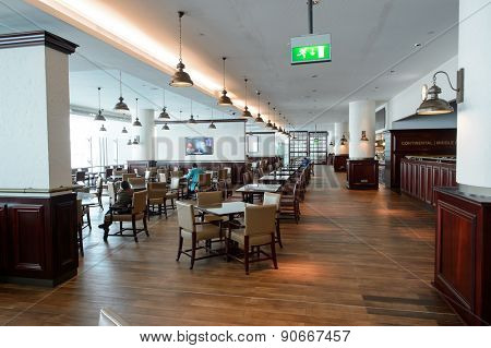 DUBAI, UAE - MARCH 10, 2015: DXB airport interior. Dubai International Airport is the primary airport serving Dubai, and is the world's busiest airport by international passenger traffic.