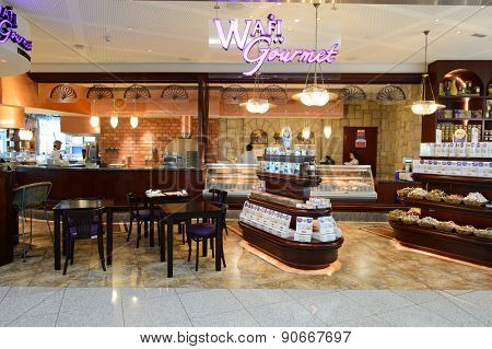 DUBAI, UAE - MARCH 10, 2015: DXB airport interior. Dubai International Airport is the primary airport serving Dubai, and is the world's busiest airport by international passenger traffic.