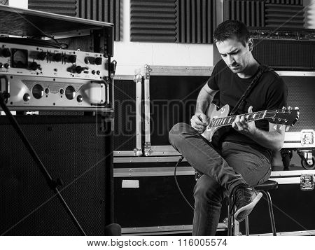 Guitarist Playing Backstage
