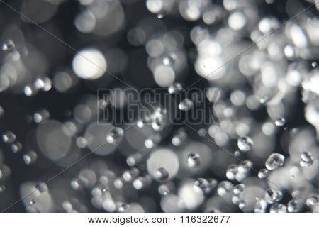Abstract blurred levitating water drops