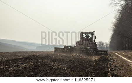 Harrowing The Soil With Disc Harrows