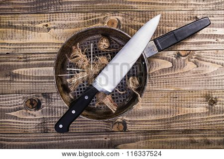 Rag Doll In Pan With Knife
