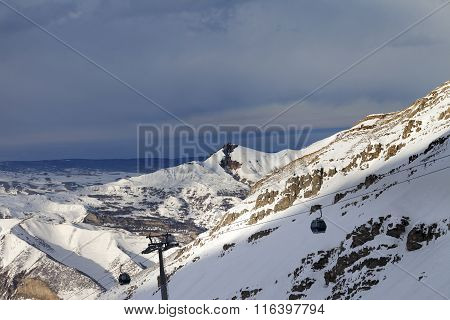 Gondola Lift On Ski Resort At Sun Evening