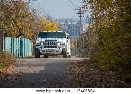 White Hummer H2 Limousine At The Rural Street
