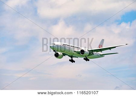 HONG KONG - JUNE 04, 2015: JAL aircraft landing at Hong Kong airport. Japan Airlines Co., Ltd (JAL) is the flag carrier airline of Japan and the second largest in the country behind All Nippon Airways