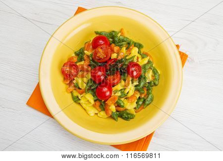 Colored Spatzle On Yellow Dish