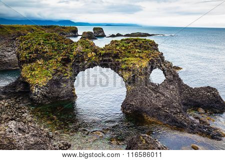 The fancy fantastic coastal cliffs Arnastapi. Travel to Iceland in the summer