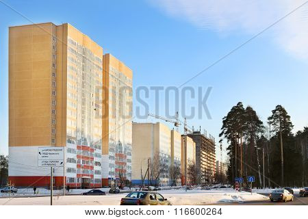 Street With Residential Buildings And Cars On Road At Winter In Perm, Russia. Text On Sign Kirovogra